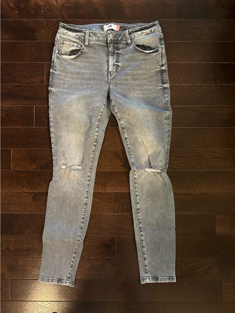 CAbi Women's Light Gray acid washed Skinny Jeans with Knee Distress